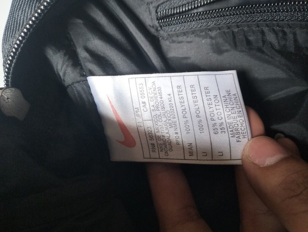 Nike Black Messenger Bag / Briefcase (Category: Briefcases) located in Baguio. Submitted by dapper_deals (Listing ID 1450997423, Image 3). Description: - Stylish black Nike bag - Versatile carrying options: top handles and detachable shoulder strap - Convenient storage: multiple front and side pockets - Secure main compartment with zipper closure - Interior zippered pocket for essentials - Durable material: polyester and cotton blend - Ideal for 