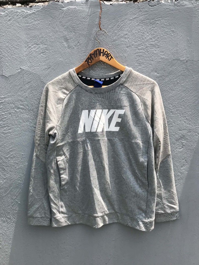 Nike Grey Crewneck Sweatshirt XL (Category: Coats, Jackets and Outerwear) located in Manila. Submitted by rhynh4rt (Listing ID 1450962045, Image 1). Description: - Grey Nike sweatshirt - Large white Nike logo on front - Raglan sleeves - Tag size: XL - Made in China - Approx. 23 inches chest measurement.