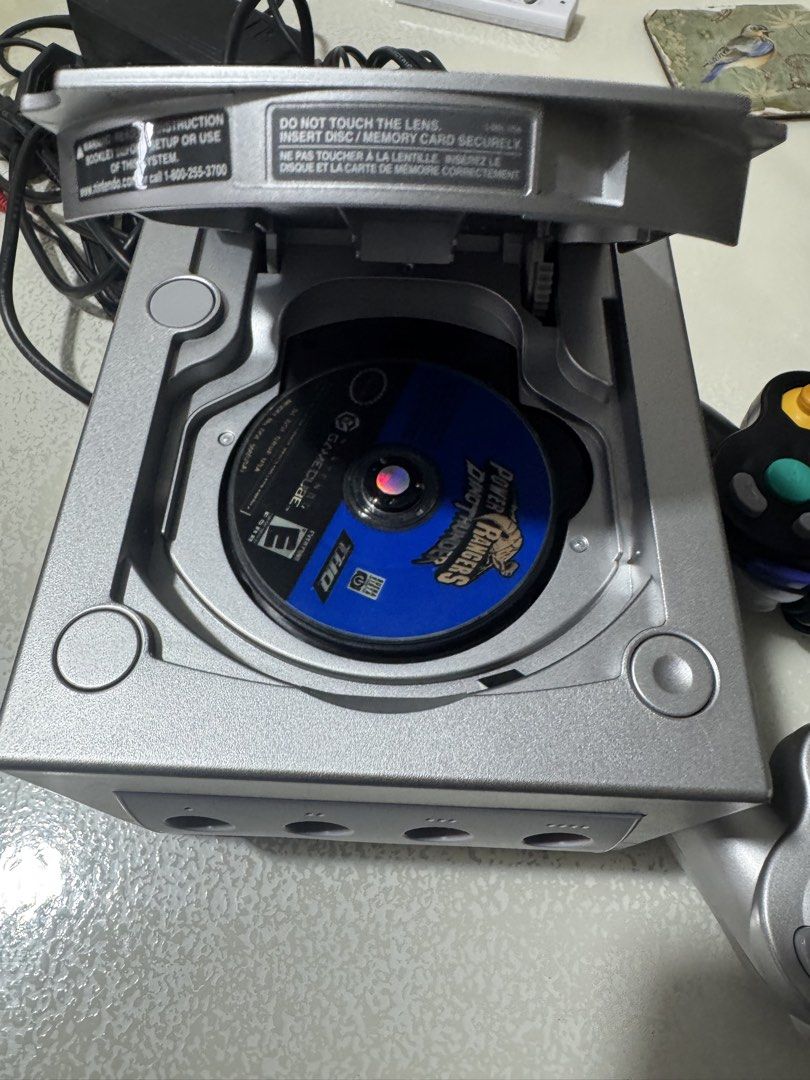 Nintendo GameCube DOL-101 Silver Console with Game (Category: Nintendo) located in Las Pinas. Submitted by marcuz1316 (Listing ID 1451042163, Image 3). Description: - Nintendo GameCube Console (Silver, DOL-101) - Includes Original Box - Comes with Power Rangers Game Disc - Ports for Controllers and Memory Cards - Ideal for Retro Gaming Enthusiasts.