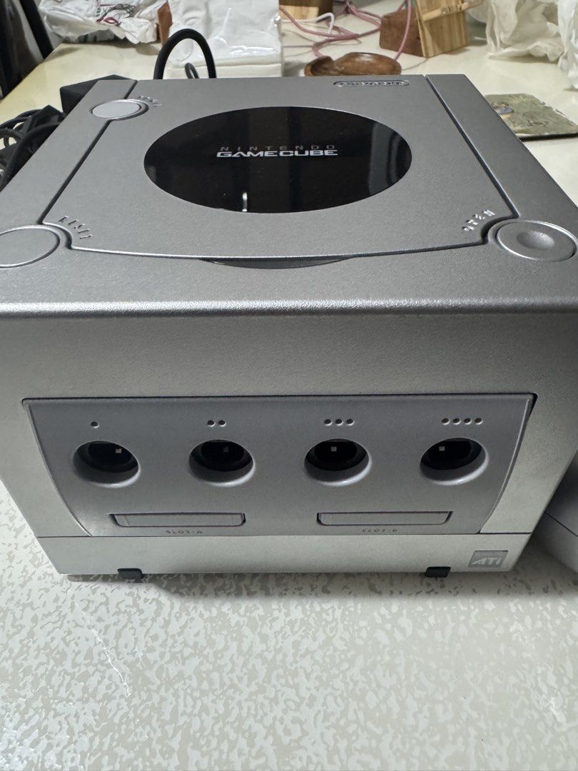 Nintendo GameCube DOL-101 Silver Console with Game (Category: Nintendo) located in Las Pinas. Submitted by marcuz1316 (Listing ID 1451042163, Image 2). Description: - Nintendo GameCube Console (Silver, DOL-101) - Includes Original Box - Comes with Power Rangers Game Disc - Ports for Controllers and Memory Cards - Ideal for Retro Gaming Enthusiasts.