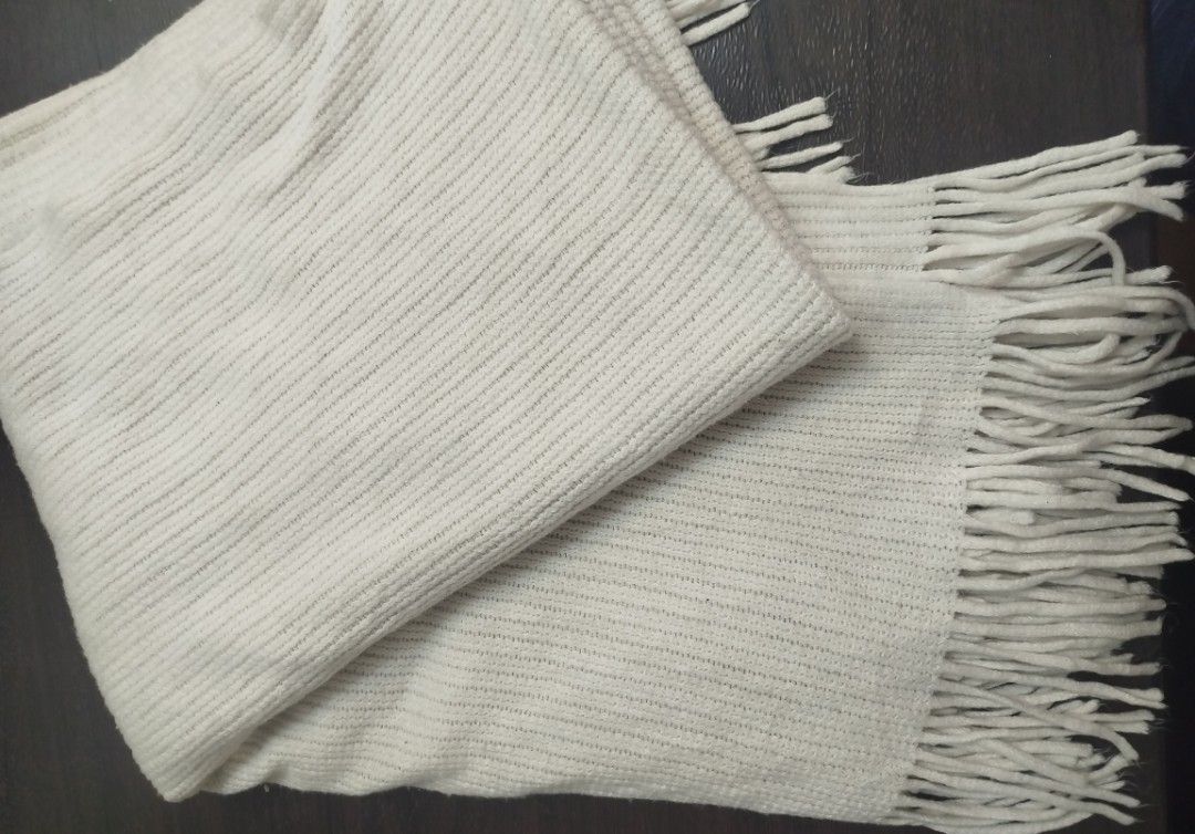 Off White Textured Poncho/Scarf with Fringe (Category: Scarves) located in Imus. Submitted by stop_shop7 (Listing ID 1450974185, Image 1). Description: - Cream or off-white textured scarf - Features a nice fringe on both ends - Subtle ribbed fabric pattern - Cozy and warm material - Ideal as a fashion accessory or for added warmth - Approximate measurements: [insert length]" x [insert width]".
