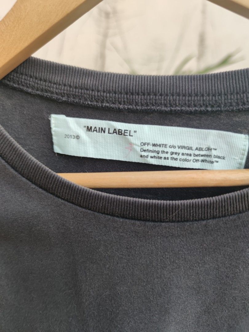 OFF-WHITE "MAIN LABEL" T-Shirt (Category: Tshirts & Polo Shirts ) located in Pasig City. Submitted by ftwind (Listing ID 1450937044, Image 3). Description: - nice aunfade - Small graphic print on the front: "OFF-WHITE c/o VIRGIL ABLOH" - Front print also includes the year "2019" - Tag details: "MAIN LABEL" and "2013".