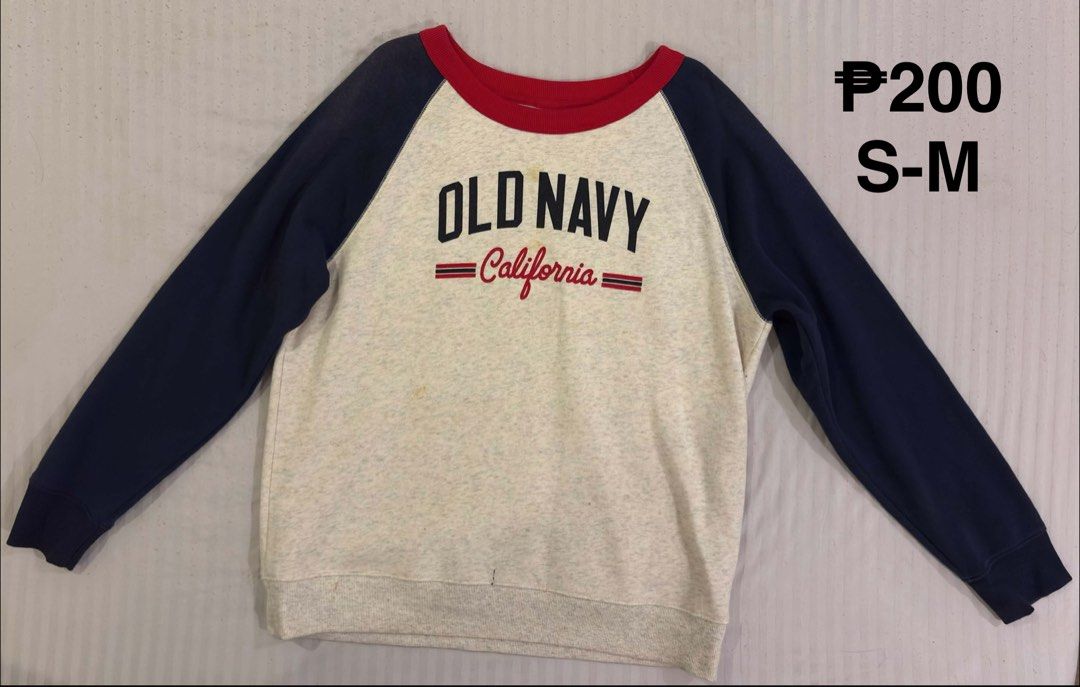 Old Navy California Raglan Sweatshirt S-M (Category: Longsleeves) located in Quezon City. Submitted by 11zerofive (Listing ID 1451049241, Image 1). Description: - Old Navy sweatshirt - Navy blue sleeves - Red neckline - 'Old Navy California' graphic print - Minor yellow stains on front - Size: S-M.