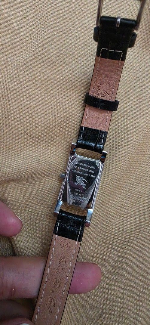 Original Burberry Rectangular Watch Black Leather Strap (Category: Women's Watches) located in Pasig City. Submitted by lfboutique (Listing ID 1450957920, Image 3). Description: - original and preloved Classic rectangular watch design - White watch face with elegant Roman numerals - Black genuine leather strap with crocodile texture - Secure silver buckle closure - Versatile for everyday wear or special occasions replaced strap damaged box pasig 