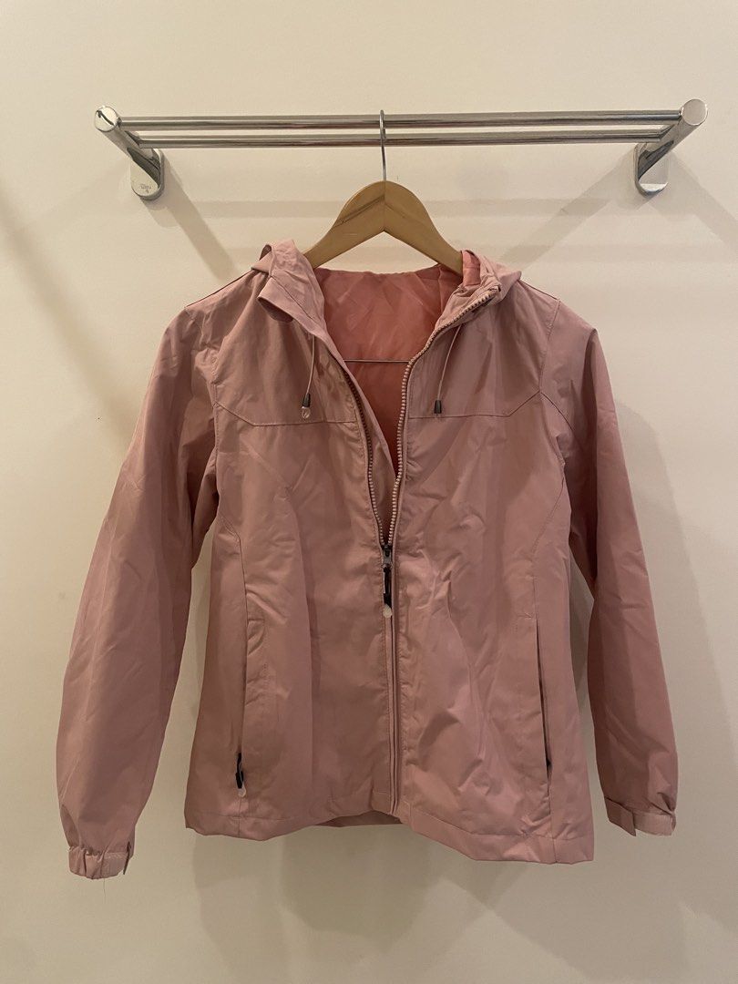 Pink Hooded Lightweight Jacket (Category: Coats, Jackets and Outerwear) located in Cordon. Submitted by secondgreatt (Listing ID 1450959588, Image 1). Description: - Light pink hooded jacket - Full zip-up front closure - Two zippered side pockets - Elastic cuffs and hem for a snug fit - Ideal for layering or protection against light rain - Lightweight and packable for convenience.