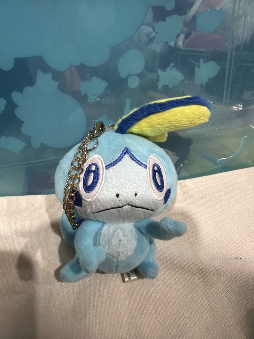 Pokemon Sobble Plush Keychain (Category: Toys & Games) located in Kuala Lumpur. Submitted by lisatoys (Listing ID 1451073872, Image 1). Description: - Adorable Sobble plush toy - Features a convenient keychain attachment - Ideal for Pokemon enthusiasts - Compact and portable size - Great for decorating bags, backpacks, and more!.