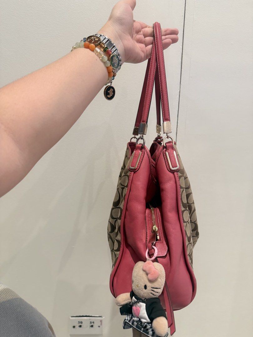 Rare Coach Pink Hobo (Category: Luxury Bags & Wallets) located in Manila. Submitted by angelcurated (Listing ID 1450945488, Image 3). Description: - Classic Coach monogram hobo bag - Chic pink leather accents and trim - Convenient side zippered pocket - Adorable Kitty and extra charm included - Ample interior space for essentials - Ideal everyday carry-all.