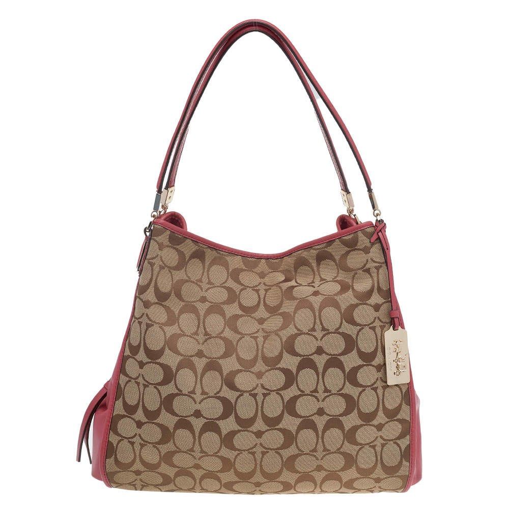 Rare Coach Pink Hobo (Category: Luxury Bags & Wallets) located in Manila. Submitted by angelcurated (Listing ID 1450945488, Image 1). Description: - Classic Coach monogram hobo bag - Chic pink leather accents and trim - Convenient side zippered pocket - Adorable Kitty and extra charm included - Ample interior space for essentials - Ideal everyday carry-all.