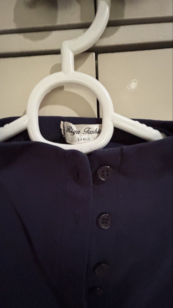 Riya Fashion Navy Blue Button Down Top Size Large (Category: Blouses) located in Manila. Submitted by daisiestuffph (Listing ID 1451023802, Image 2). Description: - Navy blue top from Riya Fashion - Size: Large - Short sleeves - High neckline - Full button-down front - Versatile for casual or work attire - Classic and simple design.