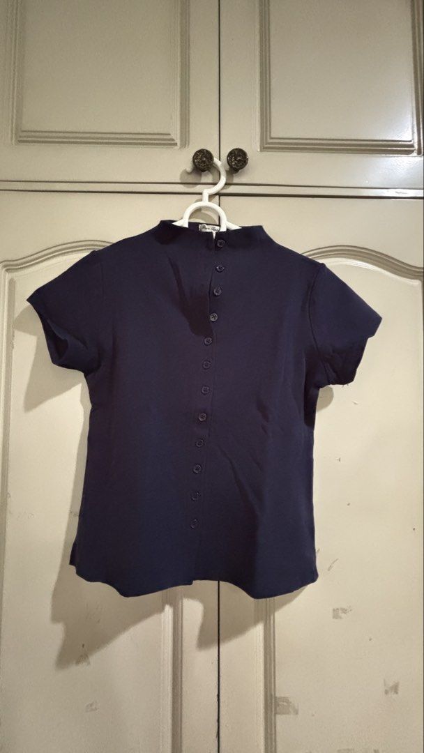 Riya Fashion Navy Blue Button Down Top Size Large (Category: Blouses) located in Manila. Submitted by daisiestuffph (Listing ID 1451023802, Image 1). Description: - Navy blue top from Riya Fashion - Size: Large - Short sleeves - High neckline - Full button-down front - Versatile for casual or work attire - Classic and simple design.