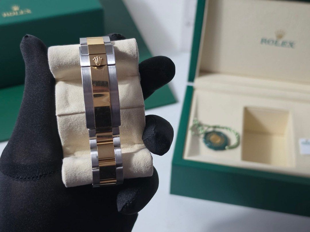 Rolex Submariner Two-Tone Automatic Watch (Category: Luxury Watches) located in Cabanatuan. Submitted by albertgonzales27 (Listing ID 1450970942, Image 3). Description: - Rolex Submariner - Two-tone stainless steel and gold - Black dial with date function - Automatic movement - Comes with original box and tag - Ideal for daily wear and special events - A timeless classic.