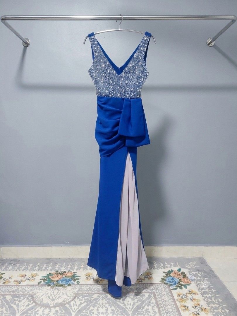 Royal Blue Embellished V-Neck Evening Gown with Slit (Category: Evening Dresses & Gowns) located in Seremban. Submitted by aswadmia (Listing ID 1451093865, Image 1). Description: - Beautiful royal blue evening gown - Features a sparkly V-neck bodice - Flattering ruched waist - Dramatic high slit for added flair - Ideal for formal events, parties, or weddings - Worn only once, still in amazing condition -I have add a chiffon material in the slit,c
