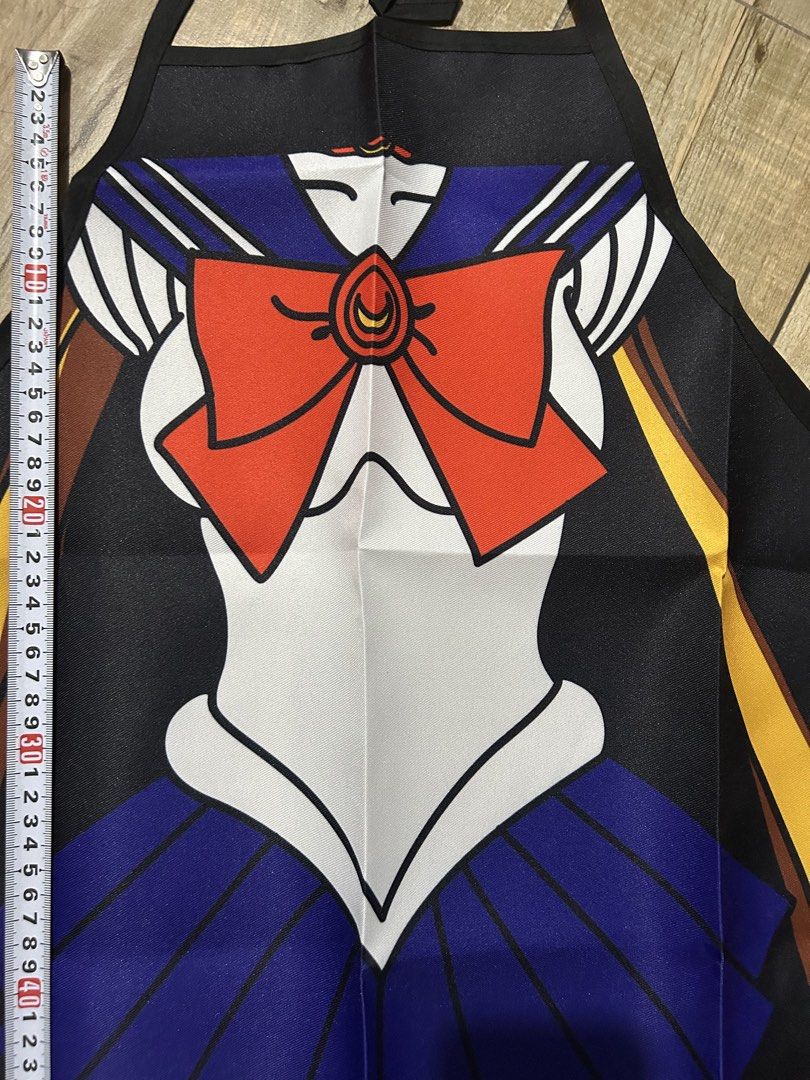 Sailor Moon Inspired Apron Cosplay (Category: Coats, Jackets and Outerwear) located in Paranaque City. Submitted by zac.sei (Listing ID 1450996614, Image 2). Description: - Cute Sailor Moon inspired apron - Ideal for cooking or as a costume - Adjustable tie-back for a perfect fit - Fun and unique design for fans - Approximately 75cm in length - Made with easy-to-clean material.