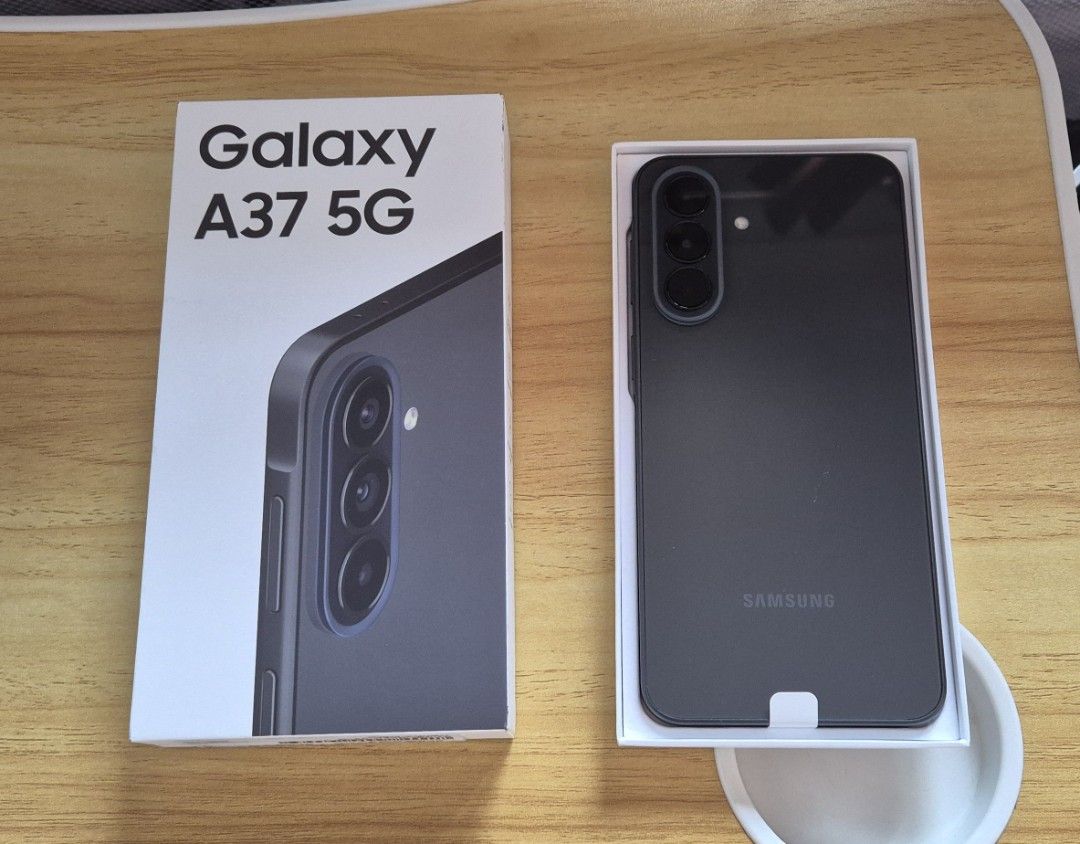 Samsung Galaxy A37 5G (Category: Samsung) located in Las Pinas. Submitted by iamraymoend (Listing ID 1451101187, Image 2). Description: Samsung Galaxy A37 5G smartphone (SM-A376B/DS) 8GB+256GB Awesome Charcoal variant Brand new, though the box has been opened to check the unit for any defects. Phone is guaranteed to be in pristine condition. Price: 19,000, but this is still very negotiable. Just send me a message for your offer..