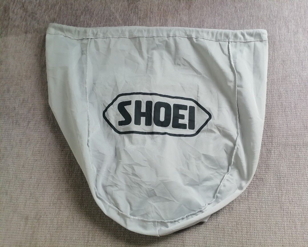 Shoei Helmet Bag free size (Category: Helmets and other Riding Gears) located in Cagayan de Oro. Submitted by emma3782 (Listing ID 1451021714, Image 1). Description: - Light grey Shoei helmet bag - Protects helmet from scratches and dust - Perfect for storage or transport - Fits most Shoei helmets - Essential accessory for your Shoei helmet.