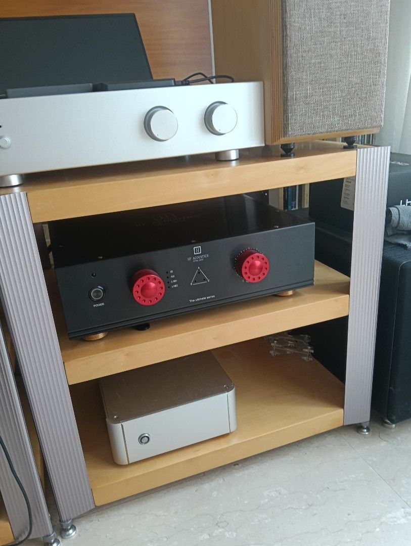 Solid Hifi Rack (Category: Other Audio Equipment) located in Singapore. Submitted by dann0202 (Listing ID 1450963906, Image 1). Description: - Tip top condition - Sturdy audio equipment stand very heavy - Three wooden shelves, solid wood panels - Supported by metal frames - Ample space for amplifiers, streamers, and other gear.