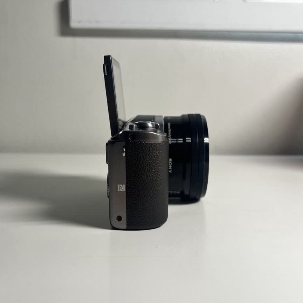 Sony Alpha A5100 Mirrorless Camera (Category: Cameras) located in Carmona. Submitted by chewychicken (Listing ID 1451025721, Image 3). Description: - Sony Alpha mirrorless camera - Includes E PZ 16-50mm OSS lens - Flip-up screen for easy vlogging and selfies - Excellent for both photography and videography - Compact and lightweight design - Ideal for travel and everyday adventures Inclusions: - Box - Manuals - Camera - Camera lens - 2x original b