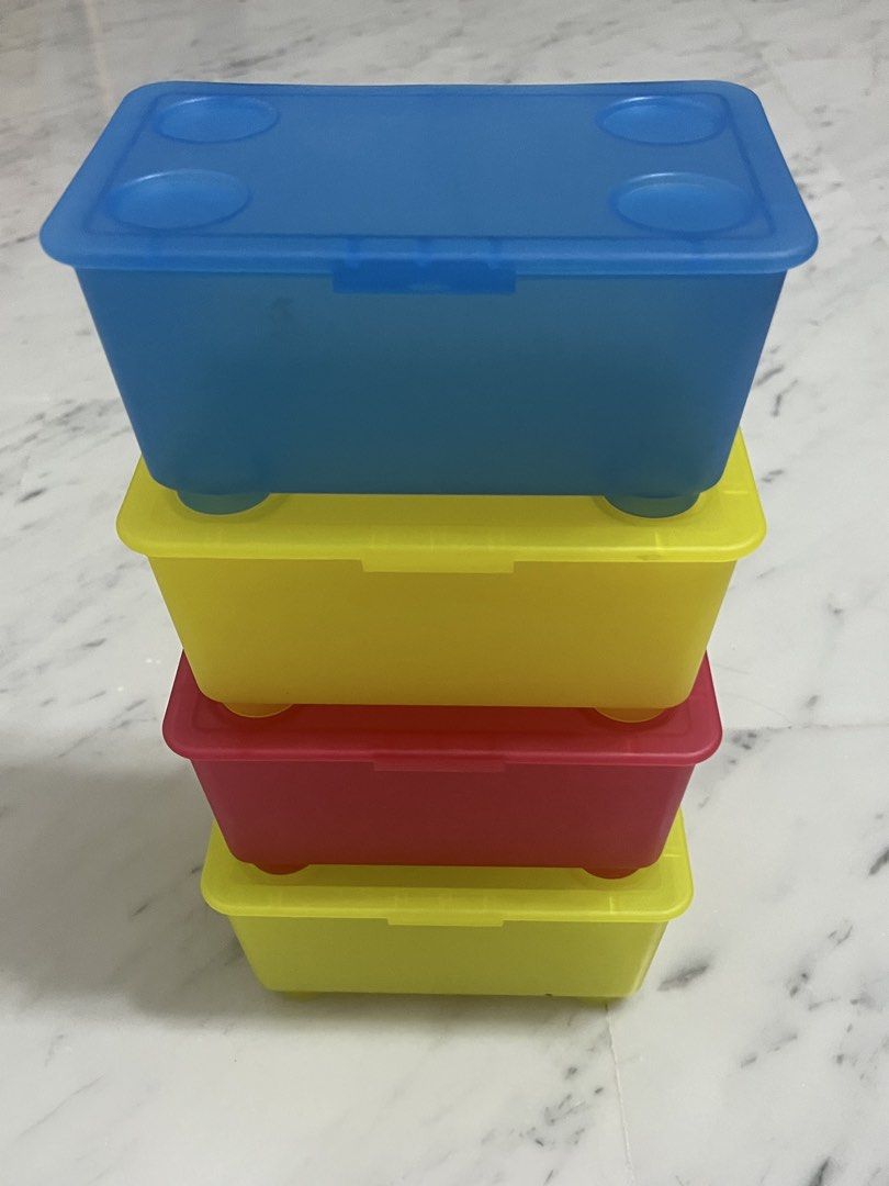 Stackable Storage Boxes (Category: Storage Boxes & Baskets) located in Singapore. Submitted by design.shopping (Listing ID 1451001113, Image 1). Description: - Set of 4 stackable storage boxes - Includes: 1 blue, 2 yellow, 1 red box - Each box comes with a secure lid - Lids feature four circular indentations for stable stacking - Ideal for organizing small items and decluttering spaces.