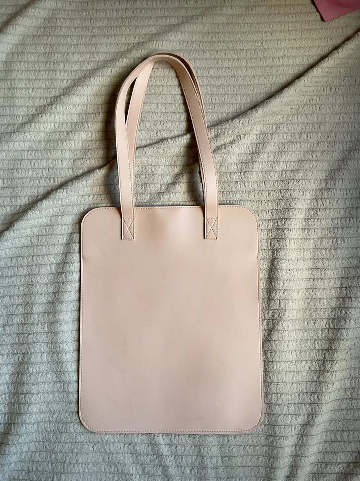 Straightforward DVL Portrait Tote Bag (Category: Laptop Bags & Sleeves) located in Cagayan de Oro. Submitted by offanglesandcolors (Listing ID 1450957411, Image 2). Description: Preloved DVL portrait tote bag from Straightforward. Originally purchased as part of a ₱999 promo for 2 bags. Used only around 2–3 times. Flat portrait-style tote bag that can fit a laptop similar in size to a MacBook M1. Includes a free black laptop bag. Condition: Very 