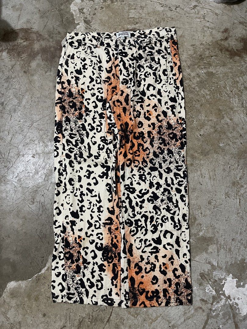 STUSSY Workgear Leopard Print Pants Size L (Category: Jeans) located in Manila. Submitted by jiahhncarl57791 (Listing ID 1451047505, Image 2). Description: - Stussy Workgear Pants - Eye-catching leopard print - Colorway: Black, beige, and orange - Closure: Button and zip - Origin: Made in China - Size: Large (L) - Perfect for adding a bold, edgy vibe to your outfit.