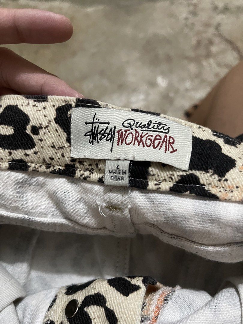 STUSSY Workgear Leopard Print Pants Size L (Category: Jeans) located in Manila. Submitted by jiahhncarl57791 (Listing ID 1451047505, Image 1). Description: - Stussy Workgear Pants - Eye-catching leopard print - Colorway: Black, beige, and orange - Closure: Button and zip - Origin: Made in China - Size: Large (L) - Perfect for adding a bold, edgy vibe to your outfit.