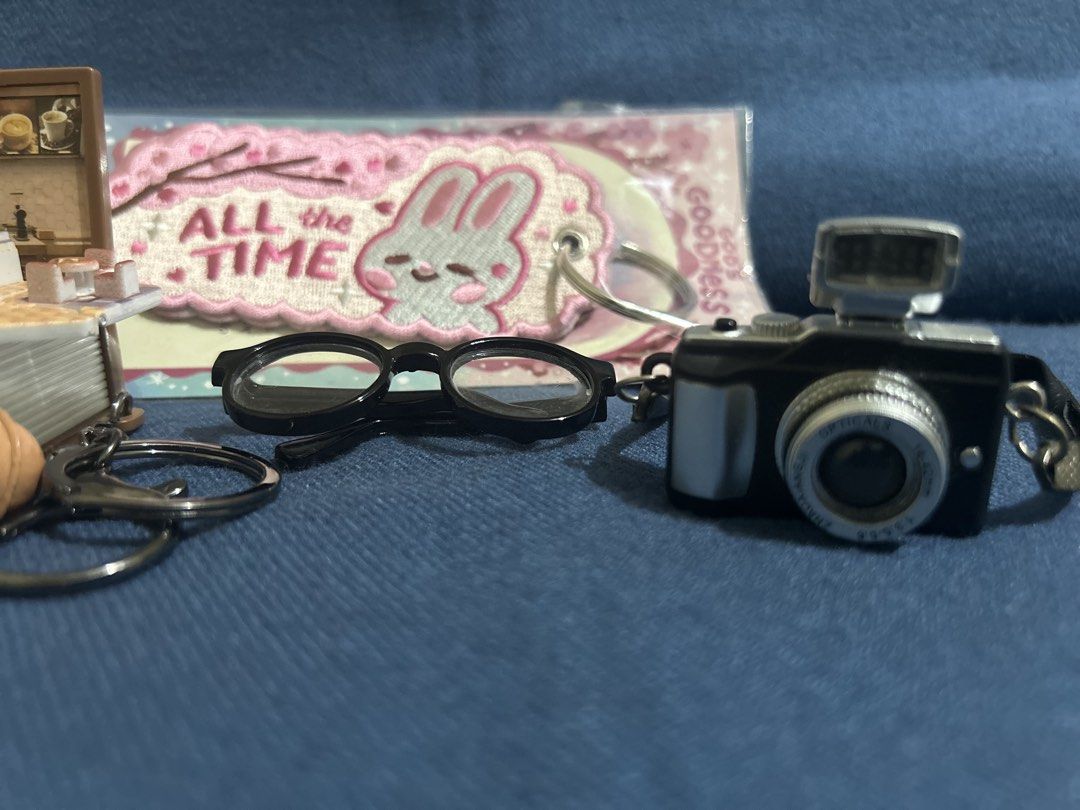 Take all: bag charms (Category: Charms) located in Marikina City. Submitted by decluttering.matters (Listing ID 1450944533, Image 3). Description: New / unused items: - bag tag with embroidered design back to back, bought from Papemelroti worth Php 269 - book bag charm/key chain (when opened, there's a miniature coffee shop), bought from a school bazaar Well-used items: - mini eyeglasses (frame is all good but medyo malabo na yung clear plastic -