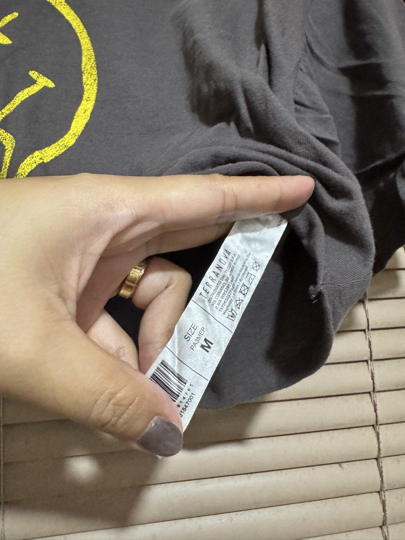 Terranova Nirvana Smiley Cropped T-Shirt Size M (Category: Shirts) located in Manila. Submitted by maria200918 (Listing ID 1450979780, Image 2). Description: - Grey cropped t-shirt - Features iconic Nirvana smiley face graphic - Bold yellow print - Brand: Terranova - Size: M - Ideal for casual outings or concerts - Versatile styling with jeans or shorts.