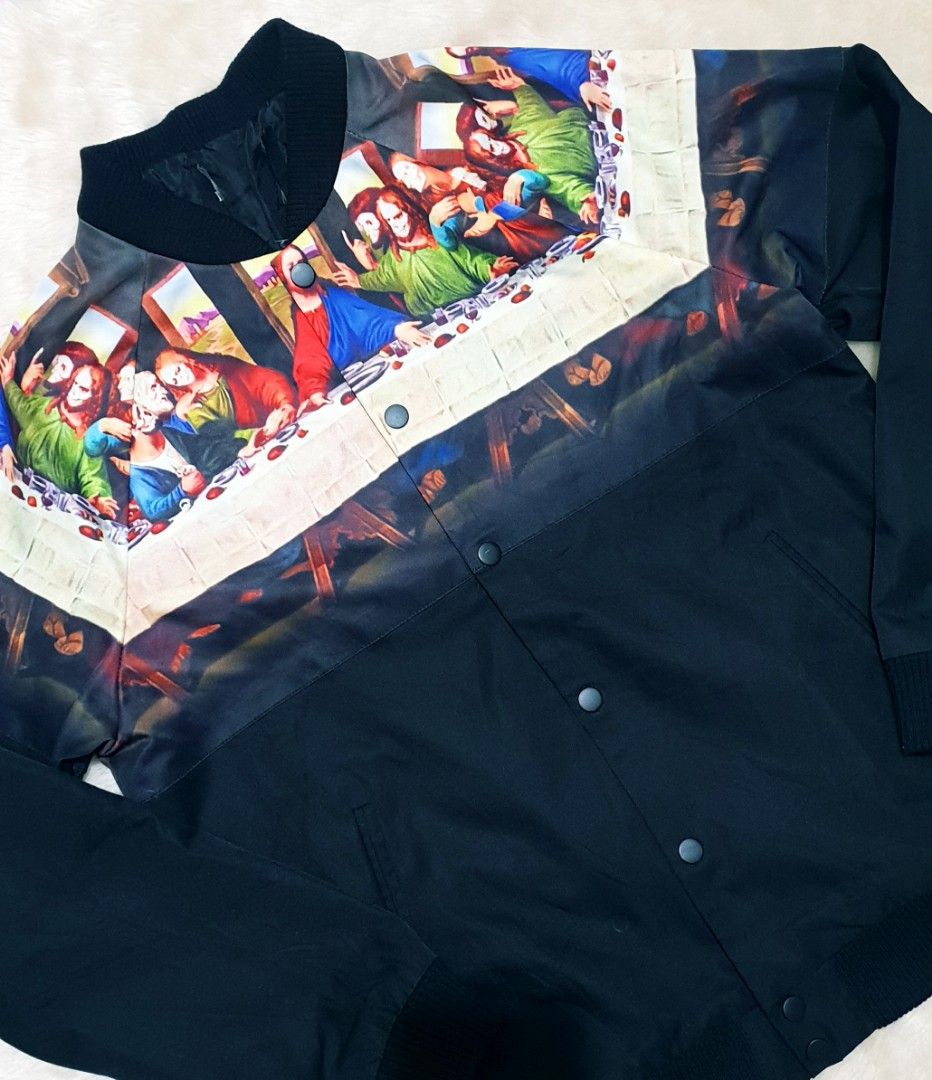 The Last Supper Jacket (Category: Coats, Jackets and Outerwear) located in Taguig. Submitted by thriftedminds (Listing ID 1451106874, Image 2). Description: Item: The Last Supper Jacket🔥 Size: Cut tag Width: 20.5 Length: 25 Condition: Excellent Issue: None DM to purchase 📩.
