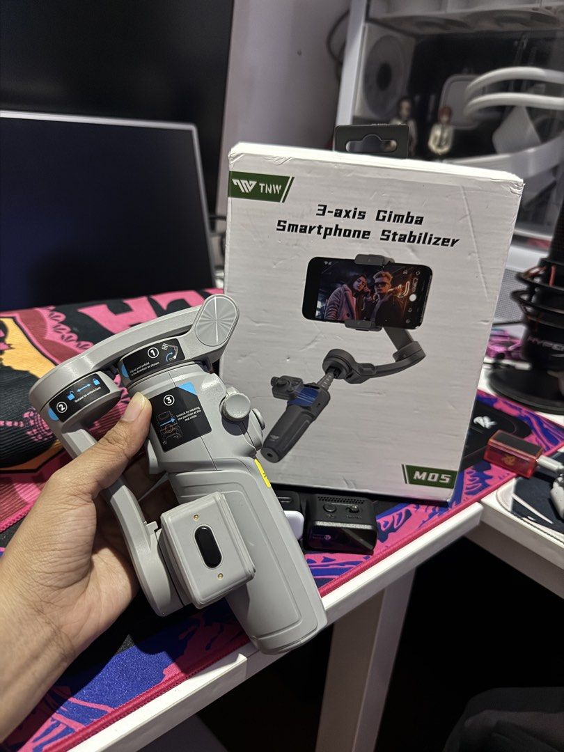 TNW MOS 3-axis Gimba Smartphone Stabilizer (Category: Gimbals & Stabilizers ) located in Manila. Submitted by kitty88888888 (Listing ID 1451109505, Image 3). Description: For Sale!! Tnw M05 Pro Gimbal Stabilizer Brand new never been used. Vinideohan lang 4k. Nego - Get super smooth video footage with the TNW MOS 3-axis gimbal stabilizer. - Easy to set up and use, perfect for beginners. - Comes with the original box for safekeeping. - Ideal for vl