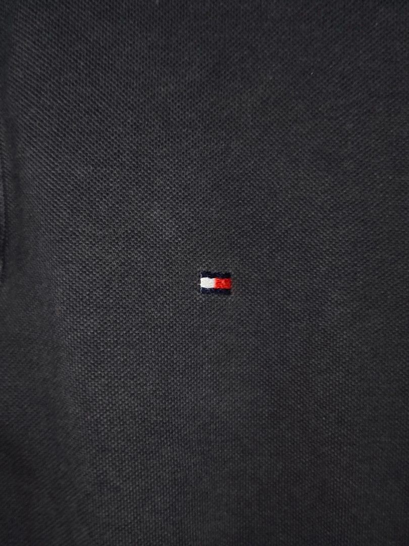 Tommy Hilfiger Black Polo Shirt (M) (Category: Tshirts & Polo Shirts ) located in Quezon City. Submitted by autodrop_ph (Listing ID 1451020413, Image 2). Description: Size: Medium Dimes. Width: 21 inches Length: 31 inches Excellent Condition..