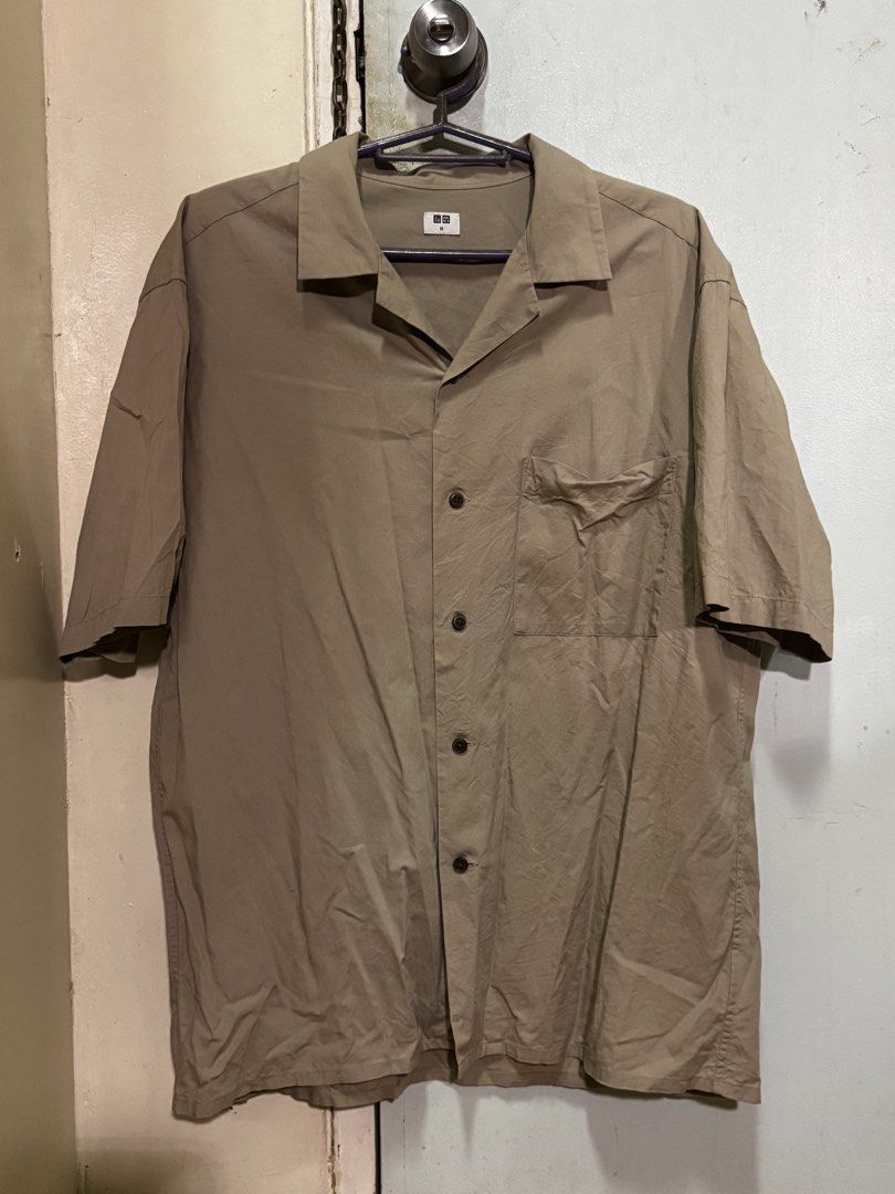 UNIQLO Khaki Button Up Polo (Medium) (Category: Tshirts & Polo Shirts ) located in Quezon City. Submitted by lemonsyellow (Listing ID 1451084981, Image 1). Description: UNIQLO Size Medium (M) RFS: Clearing out closet No Flaws QC BASED Shipping fee to be shouldered by buyer.