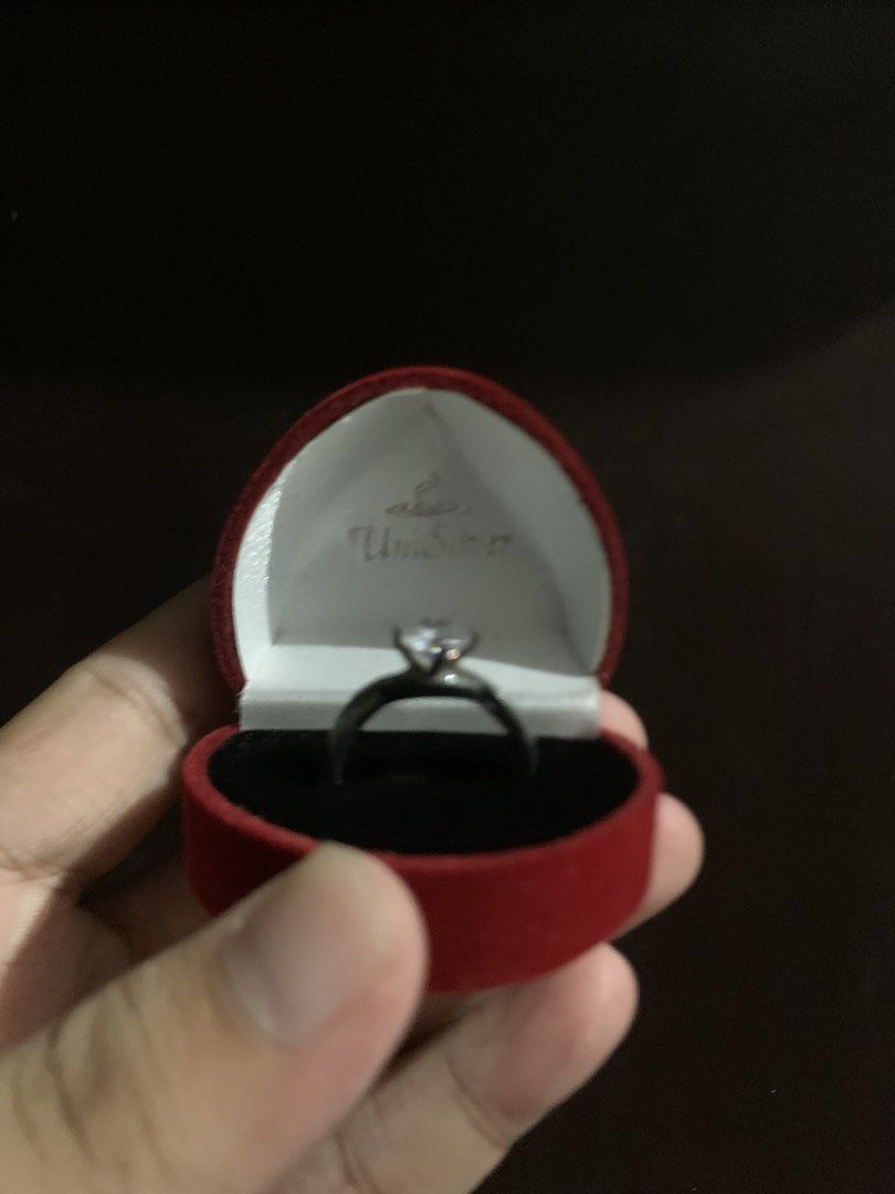 UNISILVER - 925 Sturling Silver Diamond Ring (Category: Rings) located in Manila. Submitted by djustkoni.29 (Listing ID 1450986999, Image 3). Description: Selling a beautiful UniSilver engagement-style ring. Perfect as a promise ring, fashion accessory, or placeholder ring! Brand: UniSilver Jewelry Material: Genuine 925 Sterling Silver Stone: Brilliant Round-Cut Cubic Zirconia (CZ) Condition: Great to Good condition, very shiny and well-kept. Inc