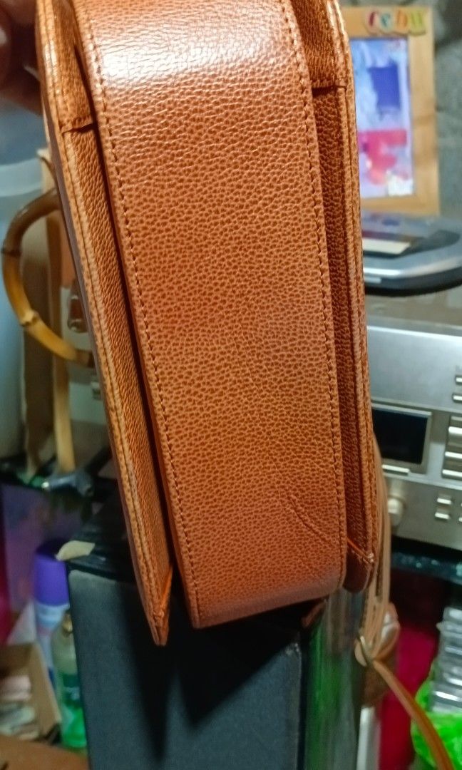 Vintage bamboo bag (Category: Luxury Bags & Wallets) located in Davao. Submitted by dgs143 (Listing ID 1450941688, Image 3). Description: StudioBell Bamboo Handle Handbag Classic bamboo handle and turn-lock closure Beautiful camel brown color Structured design Includes original care card Clean exterior and overall good condition Issue: Interior lining has peeling due to age (please see photos). Does not affect the bag's overall appearance when ca