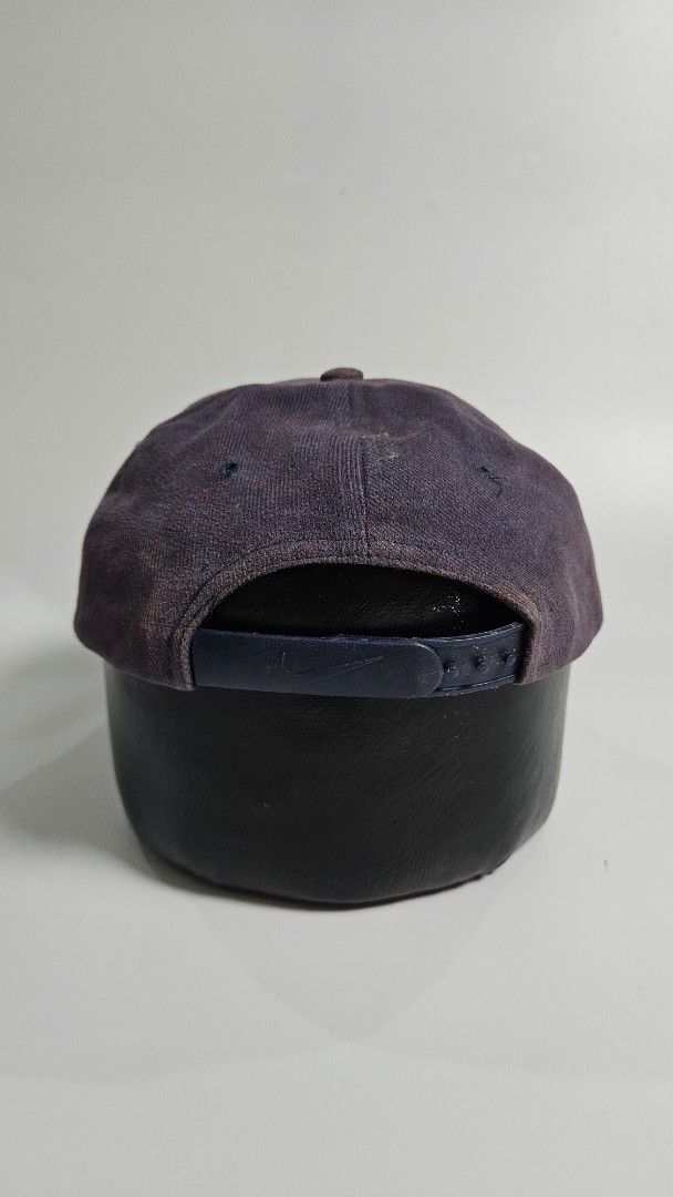 Vintage mid swoosh Nike Baseball Cap (Category: Caps & Hats) located in Alfonso. Submitted by jbcamet (Listing ID 1451034297, Image 3). Description: - Classic Nike baseball cap - Dark navy blue color - Adjustable strap at the back - Versatile for everyday wear - Shows some signs of use, but plenty of life left - Perfect for sunny days or casual outfits.