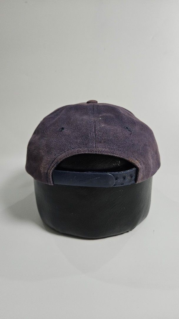 Vintage mid swoosh Nike Baseball Cap (Category: Caps & Hats) located in Alfonso. Submitted by jbcamet (Listing ID 1451034297, Image 2). Description: - Classic Nike baseball cap - Dark navy blue color - Adjustable strap at the back - Versatile for everyday wear - Shows some signs of use, but plenty of life left - Perfect for sunny days or casual outfits.