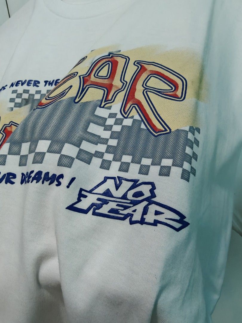 Vintage No Fear White Graphic tee (Category: Tshirts & Polo Shirts ) located in Quezon City. Submitted by lancelooot (Listing ID 1451009831, Image 2). Description: - White No Fear graphic t-shirt - Features classic No Fear logo and checkered pattern - Size XL 24.5x32 - no issue new vtg.