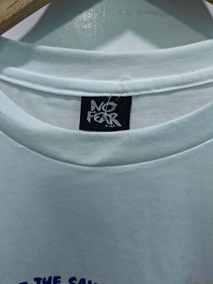 Vintage No Fear White Graphic tee (Category: Tshirts & Polo Shirts ) located in Quezon City. Submitted by lancelooot (Listing ID 1451009831, Image 3). Description: - White No Fear graphic t-shirt - Features classic No Fear logo and checkered pattern - Size XL 24.5x32 - no issue new vtg.