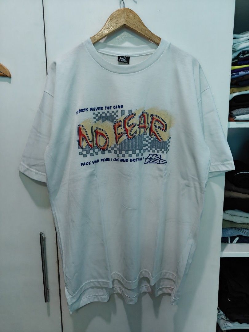 Vintage No Fear White Graphic tee (Category: Tshirts & Polo Shirts ) located in Quezon City. Submitted by lancelooot (Listing ID 1451009831, Image 1). Description: - White No Fear graphic t-shirt - Features classic No Fear logo and checkered pattern - Size XL 24.5x32 - no issue new vtg.