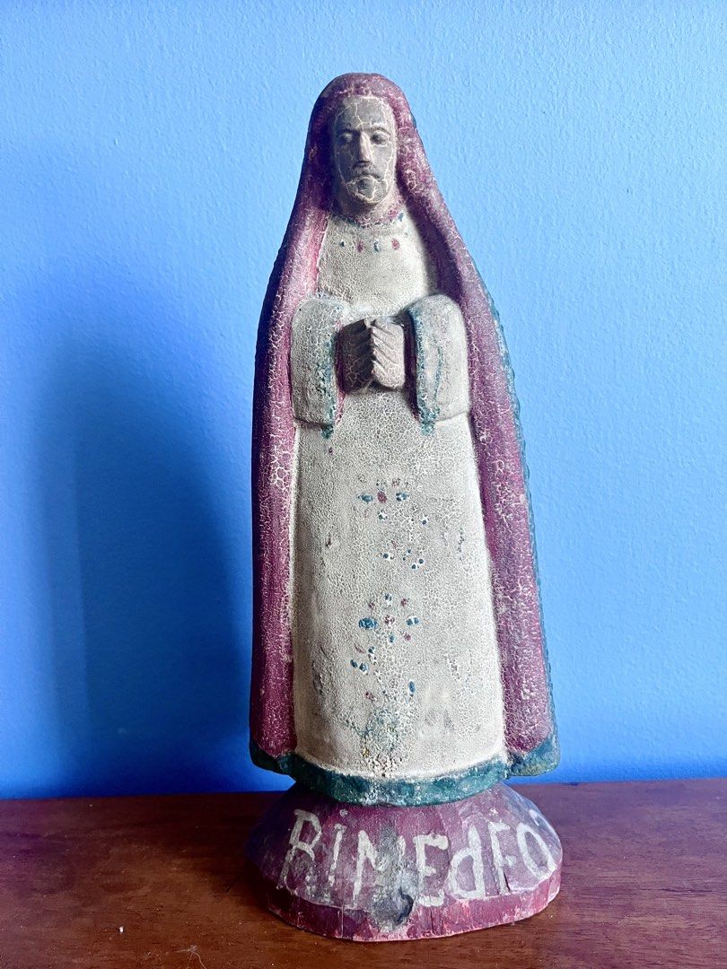 Nuestra Senora de los Remedios (Category: Religious Items) located in Mandaluyong City. Submitted by goodfair (Listing ID 1450973773, Image 1). Description: Our Lady of Remedies vintage carving: A highly collectible devotional carved piece featuring a deeply textured green cape and the clear hand-carved inscription "N S DE REMEDIO" (Nuestra Señora de los Remedios / Our Lady of Remedies) along the flared top rim. Retains prominent red and green po