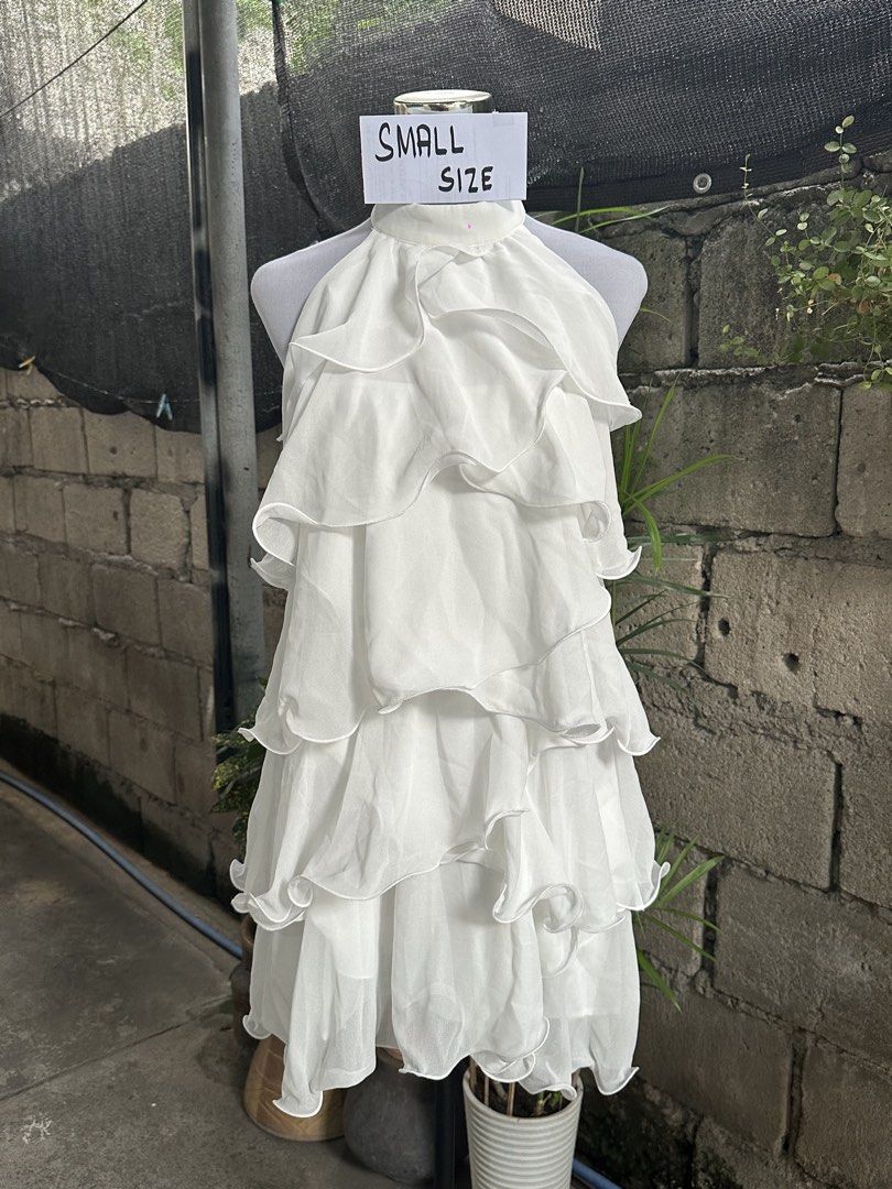White Ruffled Halter Neck Mini Dress - Small Size (Category: Dresses) located in Manila. Submitted by graciouslygraceee (Listing ID 1451092611, Image 1). Description: - White mini dress - Halter neck design - Multiple ruffled layers for a flowy, light look - Ideal for parties or a night out - Size: Small (check measurements if needed).