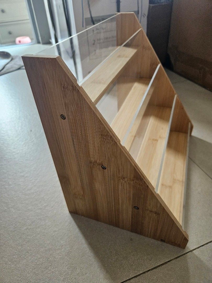 Wooden display shelf with clear acrylic front (Category: Shelves, Cabinets & Racks) located in Manila. Submitted by declutter_daruma (Listing ID 1451065806, Image 2). Description: - 4-tier display shelf - Made of durable bamboo wood - Features clear acrylic fronts on each level - Ideal for showcasing small items like collectibles or spices - Compact and space-saving design.