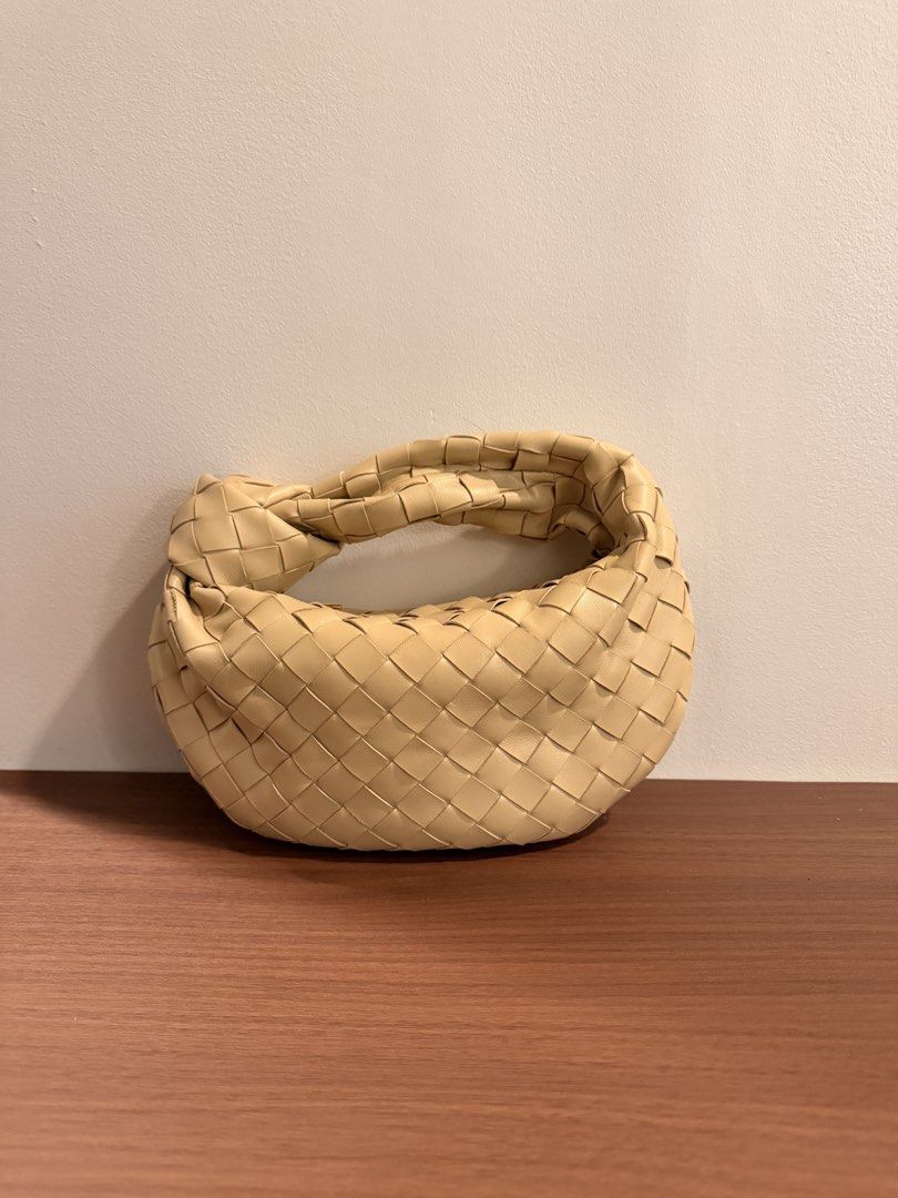 Woven Leather Knot Handle Handbag (Category: Luxury Bags & Wallets) located in Taguig. Submitted by sourcedbym (Listing ID 1451062564, Image 1). Description: - Creamy beige woven leather handbag - Unique knot handle design - Soft, rounded shape - Versatile for casual or dressed-up looks - Spacious interior for essentials - A chic and stylish accessory.