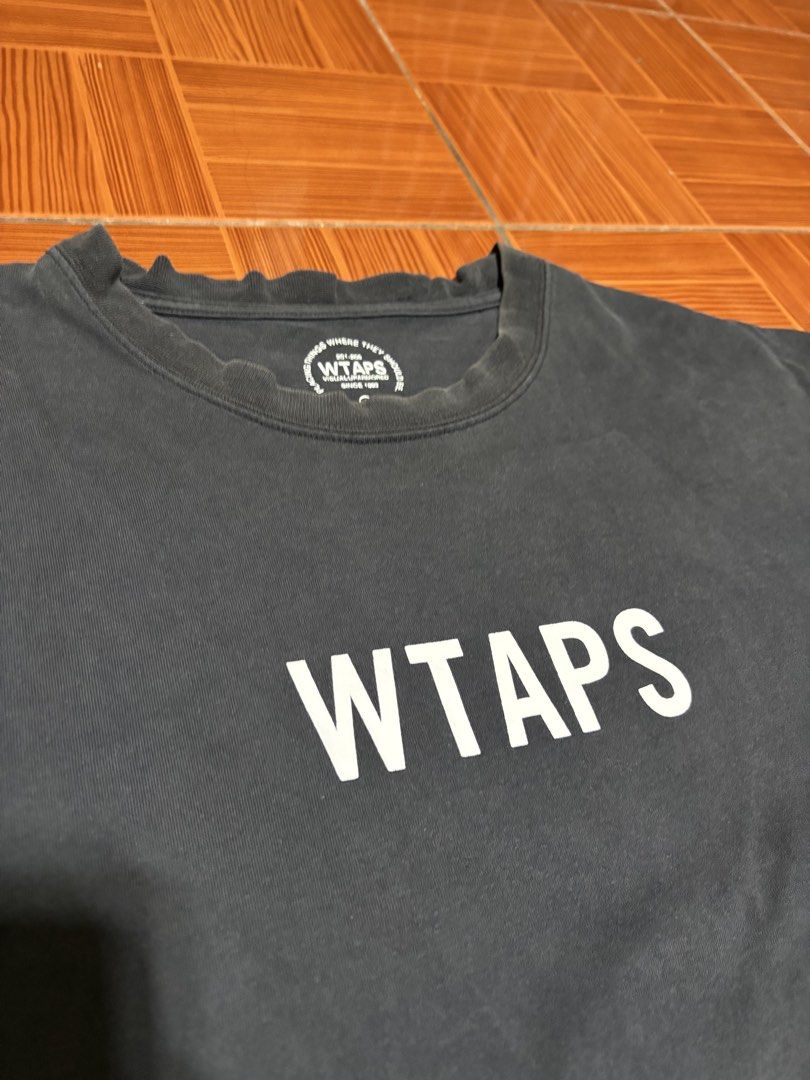 WTAPS logo tee (Category: Tshirts & Polo Shirts ) located in Manila. Submitted by jawnty (Listing ID 1451116526, Image 2). Description: WTAPS logo tee Size 4 (likely large or xl) 22/29 Issue: Slightly bacon and unoticable stains.