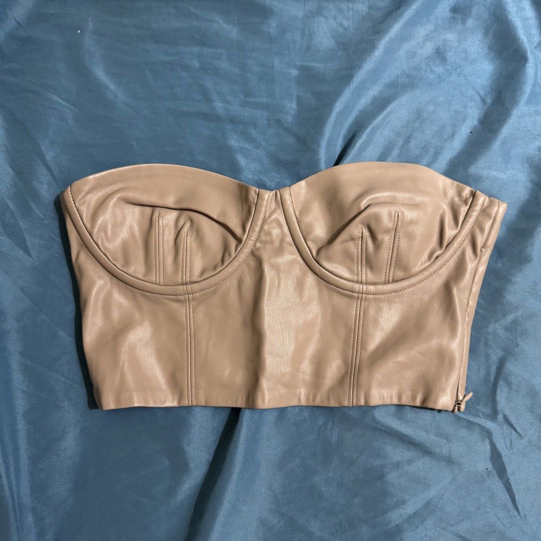 Zara Taupe Leather Corset Top (Category: Sleeveless) located in Aloran. Submitted by kheyx (Listing ID 1451075437, Image 1). Description: - Taupe faux leather corset top - Sweetheart neckline with structured cups - Smocked back for a snug fit - Side zipper closure - Versatile styling: pairs well with jeans or skirts - Super chic and trendy.