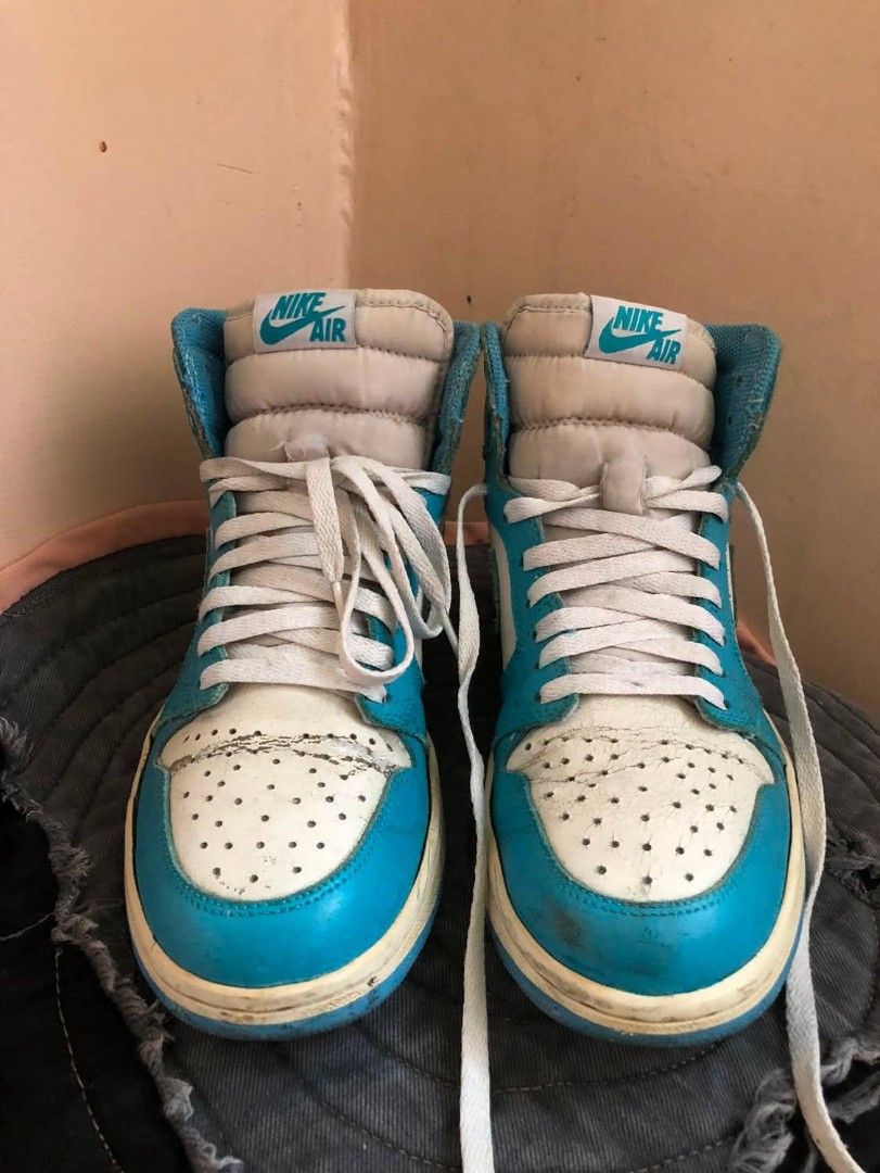 Air Jordan 1 High OG "UNC" (Category: Sneakers) located in Manila. Submitted by macchi1216 (Listing ID 1451179844, Image 1). Description: - Classic Air Jordan 1 High OG UNC - White and baby blue leather - Iconic silhouette, great for collections - Pre-owned with signs of wear, still wearable - Please check photos for condition details.