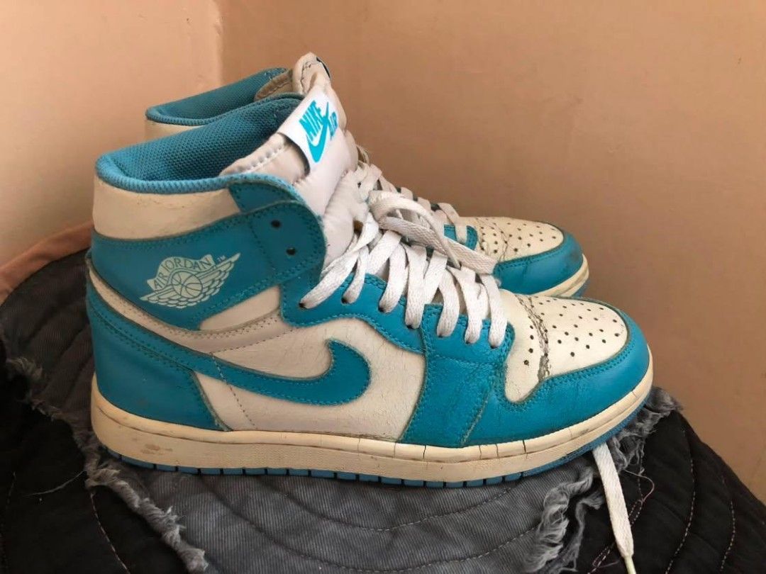Air Jordan 1 High OG "UNC" (Category: Sneakers) located in Manila. Submitted by macchi1216 (Listing ID 1451179844, Image 2). Description: - Classic Air Jordan 1 High OG UNC - White and baby blue leather - Iconic silhouette, great for collections - Pre-owned with signs of wear, still wearable - Please check photos for condition details.