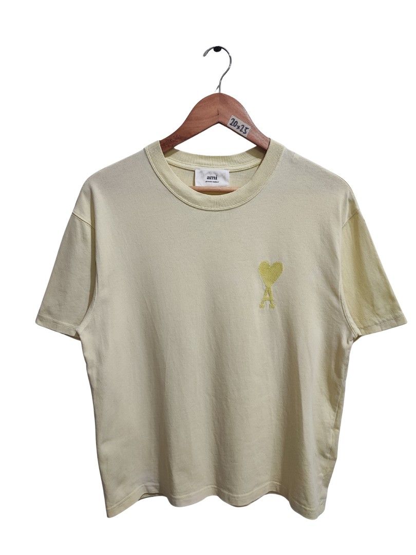 ALEXANDER MATTIUSSI 'AMI' TONAL LOGO TEE (Category: Shirts) located in Iloilo. Submitted by gooddimes (Listing ID 1451315315, Image 1). Description: Alexander Mattiussi 'Ami' - Tonal Logo Tee Authentic Pale yellow color Embroidered Chest Logo Size on tag: XS Dimes: 20Wx25L Issue/s: White fades (barely visible), check pics Color rate: 9.5/10 Good condition ₱1,000 Reminders: - All items are thrifted, please manage your expectations - Color may vary