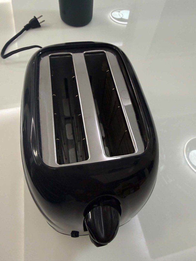 American Heritage Toaster (Category: Ovens & Toasters) located in Quezon City. Submitted by cheerupbby (Listing ID 1451317232, Image 2). Description: American Heritage HEBT-6031 2-Slice Bread Toaster. Gifted but never really used. Tried once to see if it worked, never touched it after that. Clean and great working condition. Location QC. Lalamove or Grab..