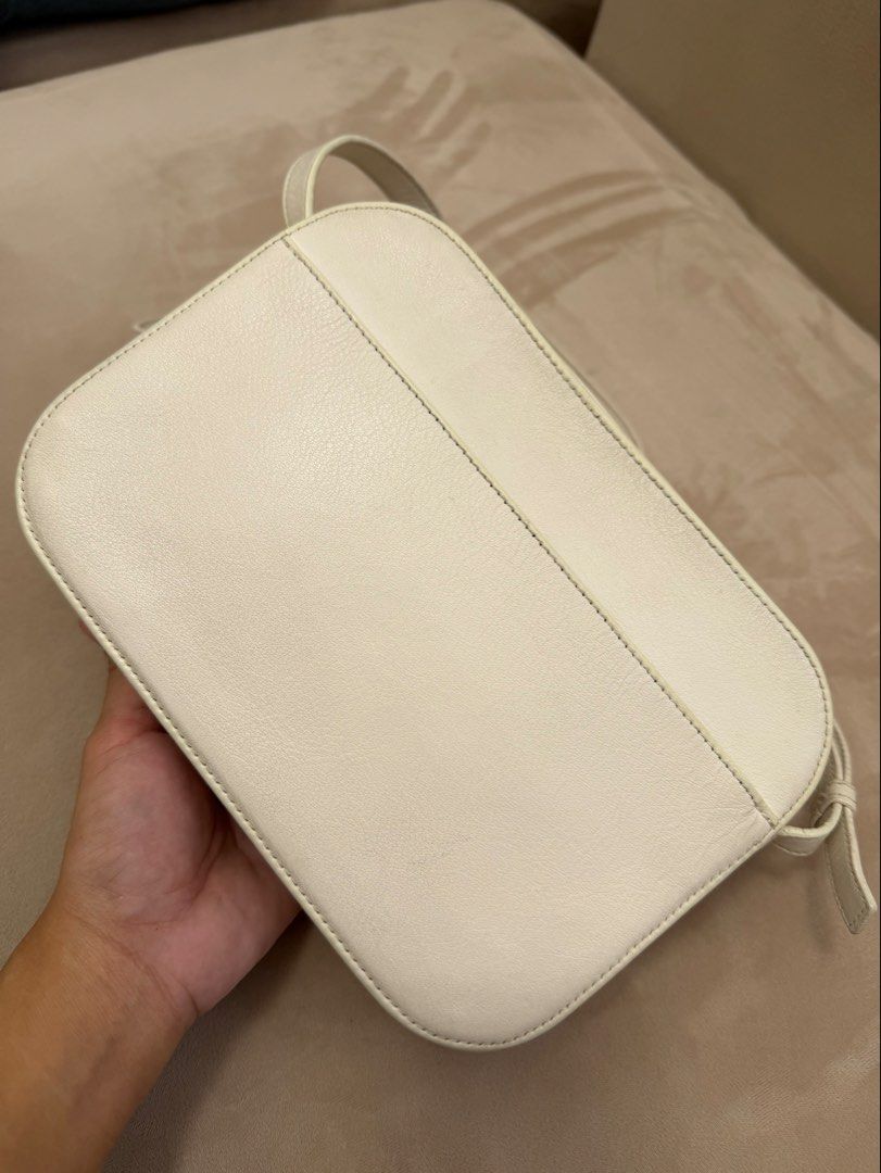 Authentic Balenciaga Camera Bag in White color (Category: Luxury Bags & Wallets) located in Manila. Submitted by maria_2326 (Listing ID 1448722350, Image 3). Description: Balenciaga Everyday Camera Bag White Color Guarantee Authentic No inclusions Please see last 2 photos for minor flaw Normal signs of used No lowballers 👎🏻 Location: Manila/QC.