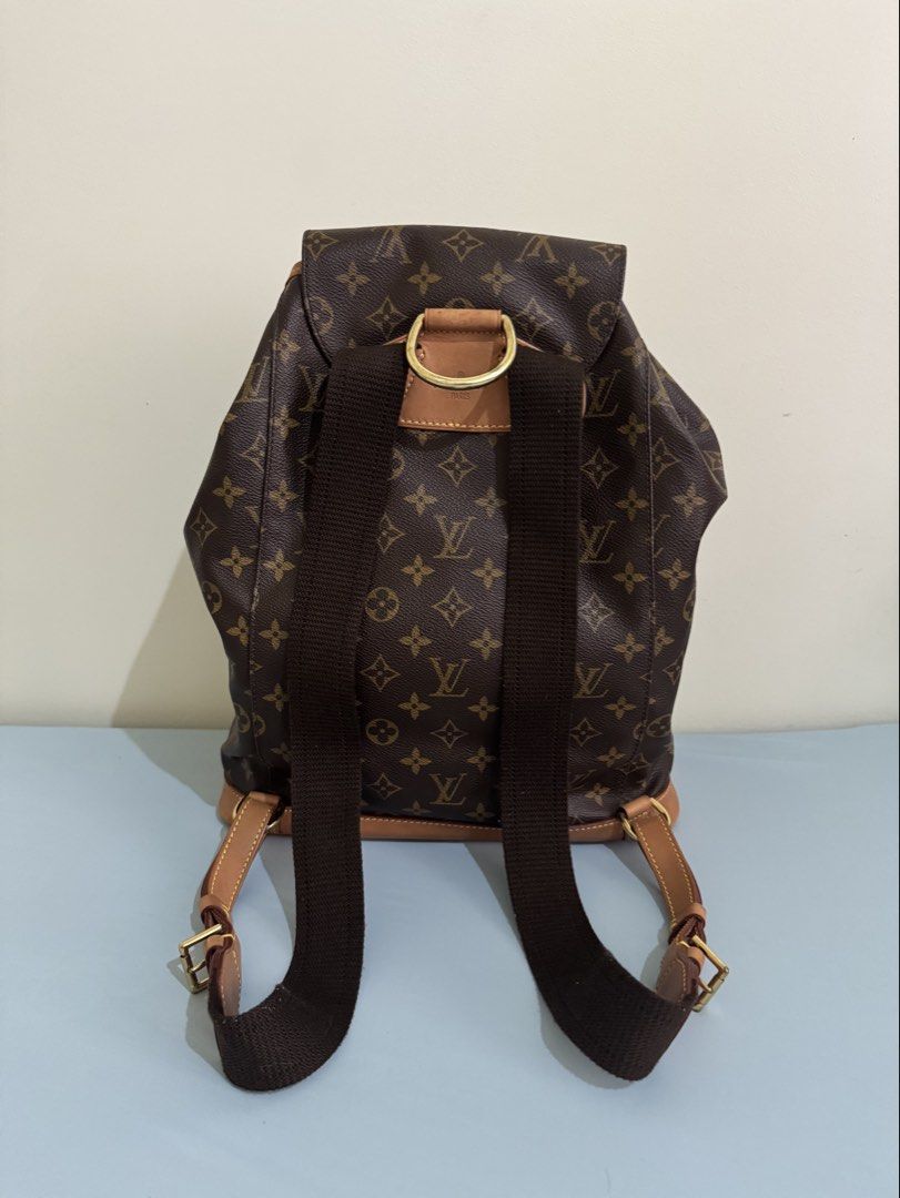 Authentic Louis Vuitton Montsouris Backpack, GM size (great condition) (Category: Luxury Bags & Wallets) located in Pasig City. Submitted by topbrandpursuits (Listing ID 1451215594, Image 2). Description: - Classic Louis Vuitton Montsouris GM backpack in great condition - Can fit laptop - Rank 9.9/10 used once or twice only) - Iconic monogram canvas with LV print - Tan leather trim - Secure drawstring closure with buckle flap - Convenient front z